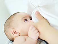 Breast feeding a baby.
