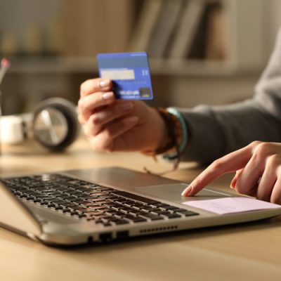 patient using a credit card to pay a bill online.