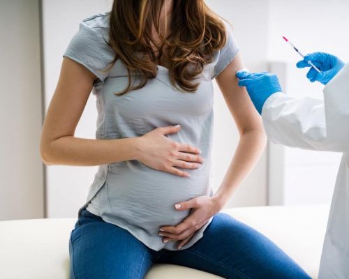 pregnant mother getting vaccinated.