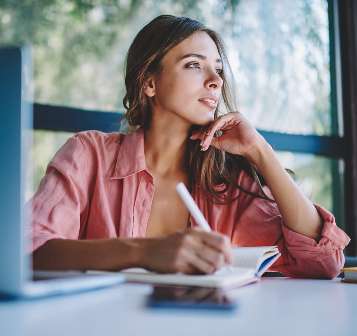 woman taking notes.