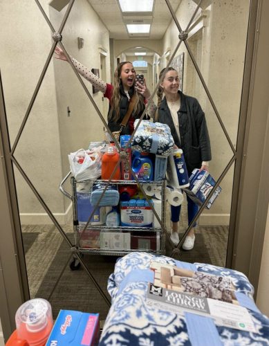 Ellie and Liberty, two estheticians show the donations gathered for The Haven.