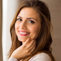 Woman with pretty smile representing a Sculptra filler treatment.